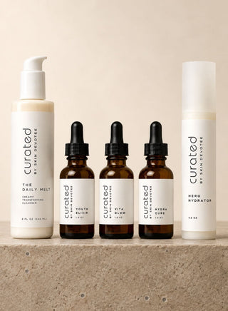 Curated By Skin Devotee product set featuring Hero Hydrator moisturizer, Vita Glow serum, Hydra Cure serum, youth Elixir serum and The Daily Melt creamy cleanser.