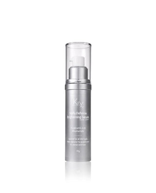 KrX Mela Defense Brightening Serum in a sleek silver cylindrical bottle with a clear cap and white pump, set against a plain white background.