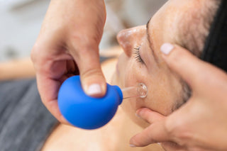 Woman receiving the Master Method Facial with lymphatic boost at Skin Devotee in Philadelphia