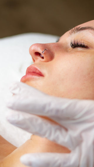 Woman getting ready to receive a professional microchanneling treatment for acne scars and texture in Philadelphia