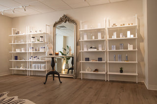 Retail wall at Skin Devotee Facial Studio in Philadelphia. Curated skincare shelves with premium products.